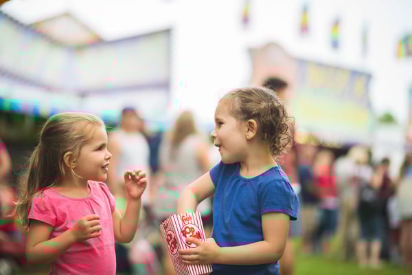 Kids talking while eating pop corn