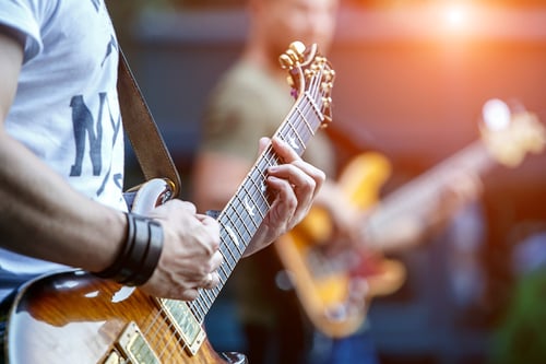 nonprofit fundraising: man playing guitar