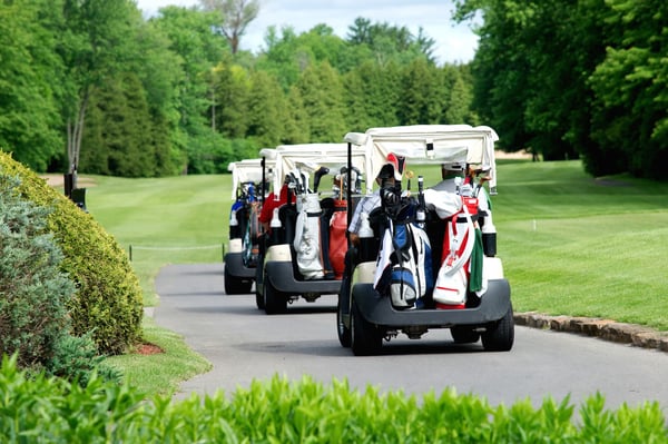 Three golf carts lined up