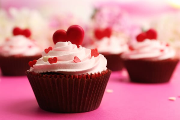fundraising ideas for nonprofits: Cupcakes with red candy hearts on top 