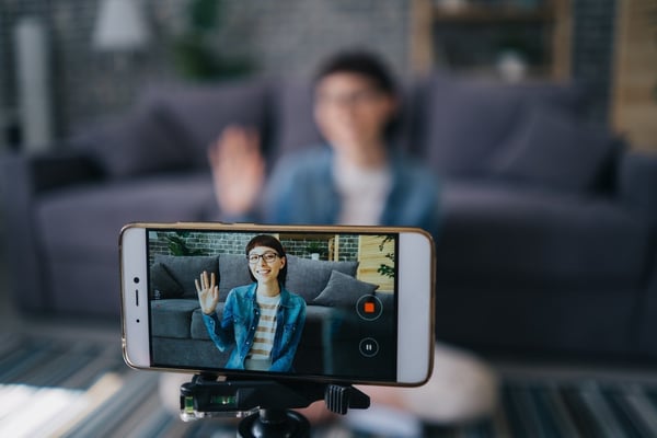 woman taking a video of herself