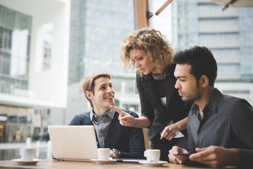 woman talking to two men