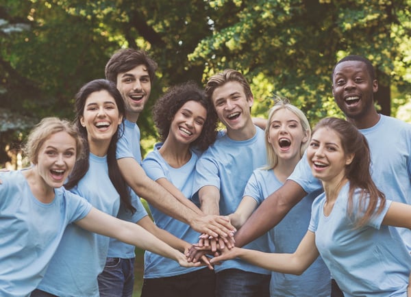 Donor engagement: Volunteers holding hands