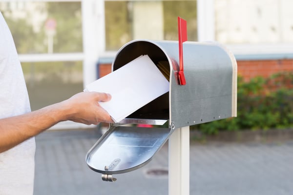 Putting fundraising letter in mailbox