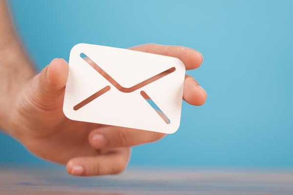 Hands holding email icon