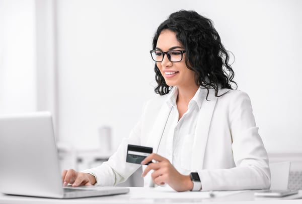 Matching gift program: Girl making donations using laptop