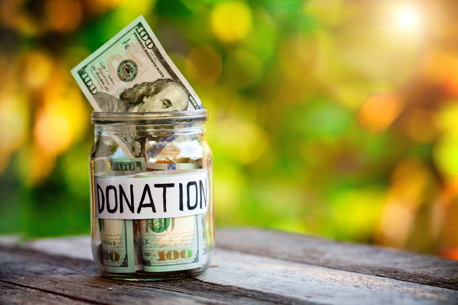 donation receipt: A jar of donation money